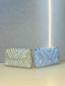 Elegant banquet clutch bag with pearls and rhinestones in gold and light blue colors