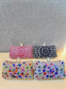 Elegant rhinestone evening clutch bags in pink and black colors with pearl metal clasp