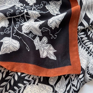Classic black and white 130cm square silk scarf with burnt orange edges and leaf patterns