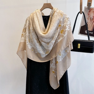 Close-up of lightweight silk-feel shawl with vintage floral print draped on a dress
