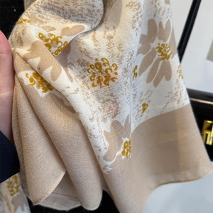 Close-up of lightweight linen texture fabric featuring vintage floral chrysanthemum prints