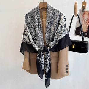 Black and white abstract geometric pattern large square scarf styled on a beige blazer
