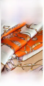 Detailed view of silk scarf with chain pattern and premium fine-stitched hem edges