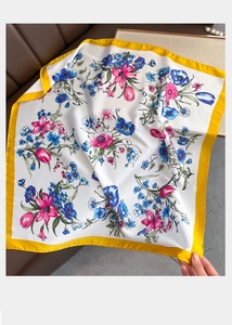 Floral print silk scarf with tulip pattern and bright yellow border on beige fabric
