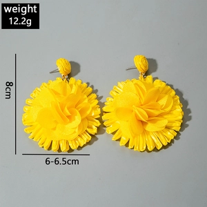 Detail view of yellow raffia flower earrings showing size 8cm and weight 12.2g specifications