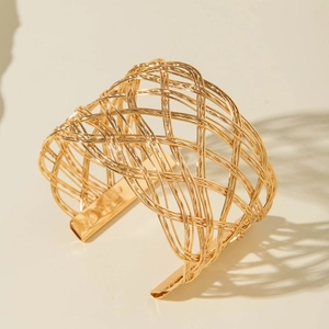Modern wide gold hollow woven cuff bracelet with minimalist geometric mesh texture