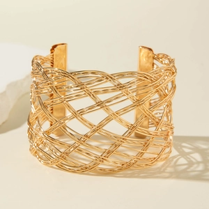 Modern gold woven hollow cuff bracelet with mesh geometric design in neutral setting
