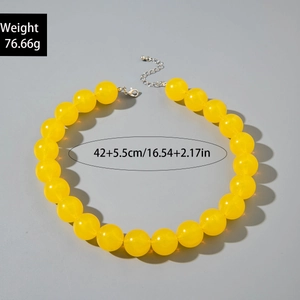 Detail of yellow acrylic beaded necklace showing 42cm length and lobster clasp