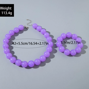 Detail shot of purple acrylic beaded necklace and bracelet set with size and weight info