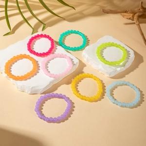 Set of 8 colorful acrylic beaded stretch bracelets in vibrant dopamine hues