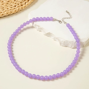 Detailed shot of purple beaded necklace with silver lobster clasp and extender chain