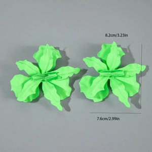 Detail view of neon green matte flower earrings with 8.2cm x 7.6cm size dimensions