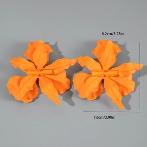 Detailed view of orange metal flower earrings showing 8.2cm size measurements and texture