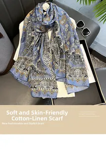 Detail of soft cotton linen shawl featuring a light blue vintage paisley floral print