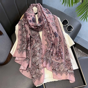 Detailed paisley print on long vintage-style shawl with soft cotton-linen texture
