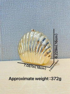 Golden shell-shaped metal evening clutch bag with size and weight dimensions shown