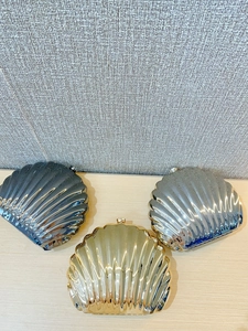 Shell shaped metallic evening clutch bags in gold, silver and gunmetal finish