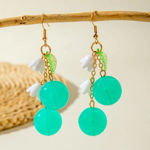 Summer cherry earrings with green beads and white lily pendants on golden chains