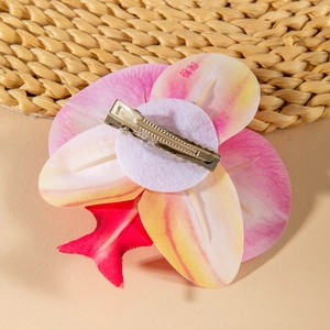 Detailed back view of pink gradient orchid hair clip with metal alligator grip