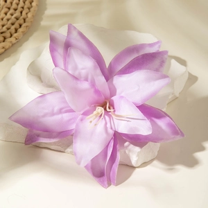 Detailed macro of a purple gradient lily hair clip made of high-quality fabric petals