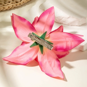 Detail of pink gradient lily hair clip with a sturdy silver metal duckbill attachment