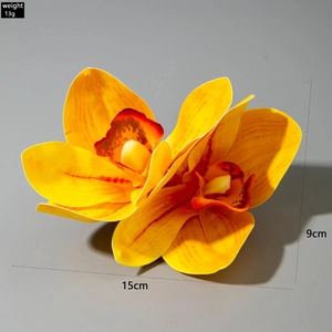 Detail view of yellow lily flower hair clip showing 15cm x 9cm size and 13g weight