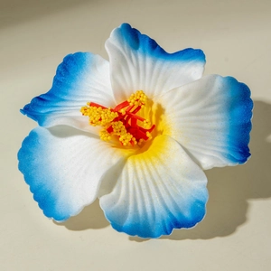 Detailed macro view of white and blue gradient Hibiscus flower hair clip made of EVA foam