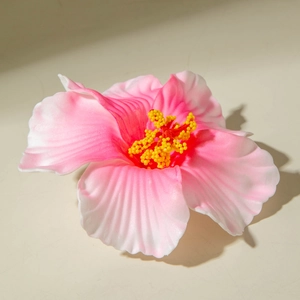 Detailed view of realistic lily hair clip with pink-white gradient petals and yellow pistils