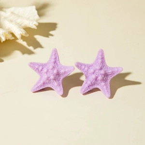 Detailed view of purple resin starfish earrings with realistic textured finish and matte surface