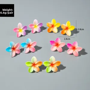 Detailed close-up of 5 pairs of colorful resin daisy earrings with size measurements