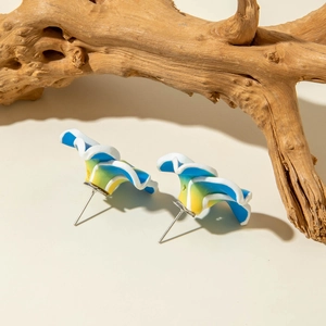 Macro detail of wave-textured daisy resin earrings with colorful floral petal gradients