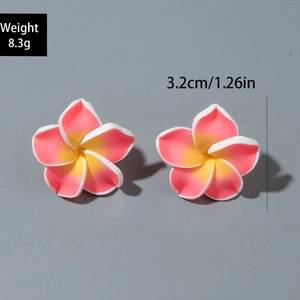 Detail view of resin frangipani earrings with weight and size data 3.2cm 8.3g