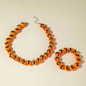 Halloween jewelry set featuring orange beaded necklace and bracelet with bat prints