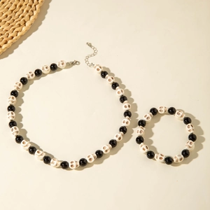 Gothic skull bead necklace and bracelet set featuring black glossy beads and silver lobster clasp