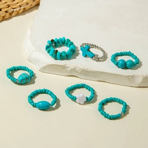 Bohemian turquoise bead ring set with silver cross and pearl accents on stone