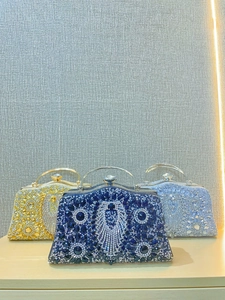 Luxury rhinestone evening clutch bags in gold, blue, and silver with crystal handles