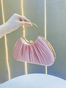 Pink pleated evening clutch bag with golden circular metal handle for women