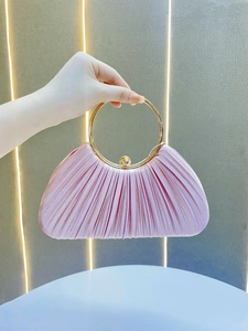Elegant pink pleated evening handbag with gold circular metal handle and ball clasp