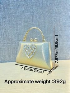 Elegant gold glitter evening clutch bag with heart rhinestone decor and metal handle
