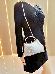 White satin evening bag with 3D fabric flower detail and elegant pearl shoulder strap