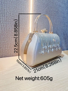 Luxury rhinestone evening bag with elegant tassel fringe and gold round handles