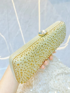 Sparkling gold crystal clutch bag with hard shell design for elegant evening parties