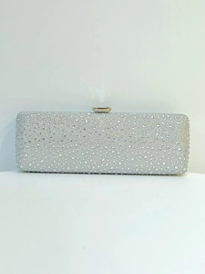 Detail of silver rhinestone evening clutch bag with crystal rectangle clasp closure