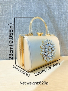Elegant gold evening bag with sunflower crystal pattern and metallic handle for women