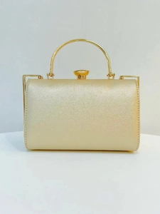 Champagne gold evening clutch bag with sparkling finish and crystal clasp on metal handle