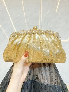 Detailed champagne gold evening clutch with sequins, flower rhinestones and gold ball clasp