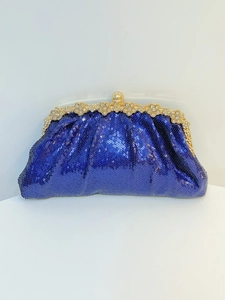 Detail of navy blue sequin evening clutch bag with gold floral rhinestone clasp