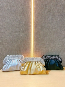 Elegant rhinestone evening clutches in silver, gold, and black with pleated satin design