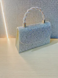Sparkling silver rhinestone evening handbag with woven handle and dimensions shown