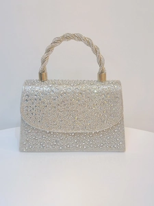 Detailed front view of silver clutch with full rhinestone crystals and braided handle